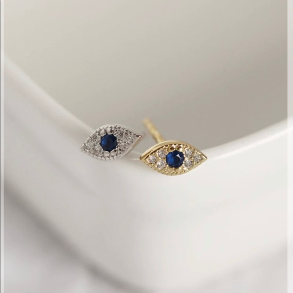Gold plated evil eye studs.
